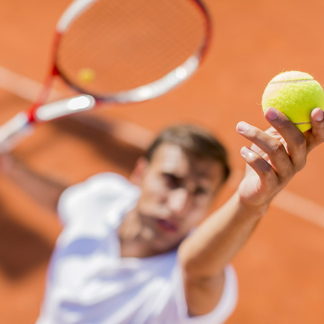Young man playing tennis